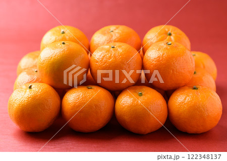 Mandarin tangerine orange fruit on red background, Lucky food in Lunar New Year or Chinese New Year 122348137