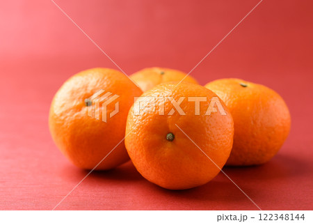 Mandarin tangerine orange fruit on red background, Lucky food in Lunar New Year or Chinese New Year 122348144