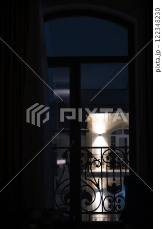 Hotel window with forged fence. Night Hotel window with forged fence. Night 122348230