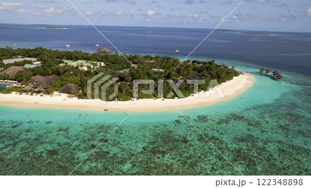 Turquoise clear water and green island of Maldives Turquoise clear water and green island of Maldives 122348898