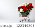 Shopping cart with red and white roses on white background 122349203
