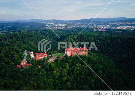 Aerial view of historic medieval castle surrounded by forest. Ksiaz castle in Walbrzych, Poland Aerial view of historic medieval castle surrounded by forest. Ksiaz castle in Walbrzych, Poland 122349578