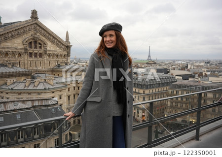 Stylish Woman on Paris Rooftop with Eiffel Tower View Stylish Woman on Paris Rooftop with Eiffel Tower View 122350001