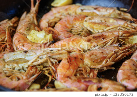 Fried langoustines with Lemon Pepper Butter. Fried shrimps. 122350172