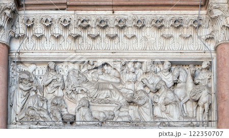 Annunciation, Nativity and Adoration of the Magi, lunette over the portal of Cathedral of St Martin in Lucca, Italy 122350707