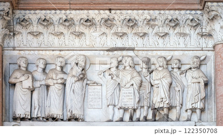 The right portal of the Cathedral of St Martin in Lucca. Lunette dedicated to the life of Saint Regulus, Lucca, Italy. 122350708