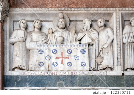 Detail of the bass-relief representing the Stories of St. Martin; preserved in the Portico of the Cathedral of St. Martin in Lucca, Italy 122350711