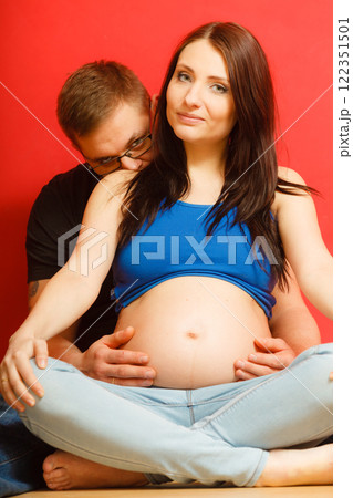 Pregnant woman with her man husband Pregnant woman with her man husband 122351501