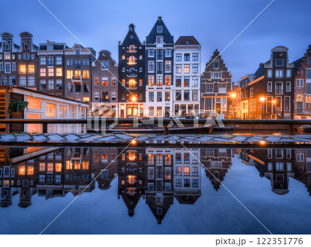 Amsterdam, Netherlands. Evening cityscape. Dark sky and city lights. Dutch canals. Amsterdam, Netherlands. Evening cityscape. Dark sky and city lights. Dutch canals. 122351776