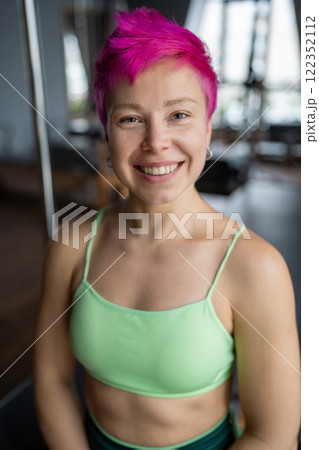 Portrait of woman pilates trainer standing near the Ladder Barrel. Pilates equipment. Pilates studio machine for fitness workouts in gym. Fit, healthy and strong authentical body. Fitness concept Portrait of woman pilates trainer standing near the Ladder Barrel. Pilates equipment. Pilates studio machine for fitness workouts in gym. Fit, healthy and strong authentical body. Fitness concept 122352112