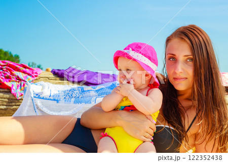 Mother and baby posing in swimsuit 122352438