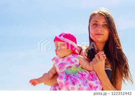 Mother and baby holding in swimsuit Mother and baby holding in swimsuit 122352442