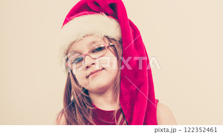 Christmas girl in santa hat festive outfit Christmas girl in santa hat festive outfit 122352461