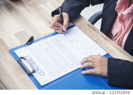 Close up businesswoman hands manager signing reading business contract document. Businesspeople hand use pen signing contract start up small projects in conference room. Business agreement concepts 122352658