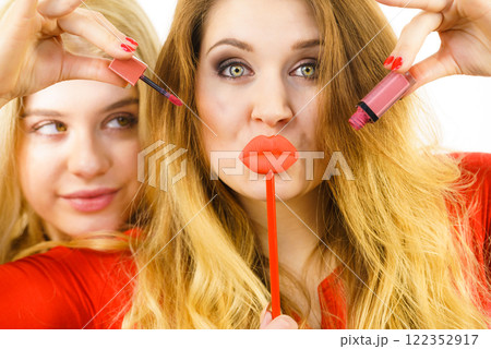 Two women and lip product 122352917