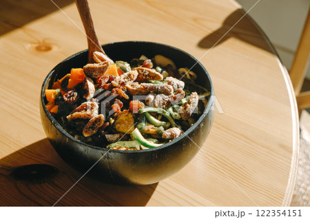 coconut bowl with salad on a table coconut bowl with salad on a table 122354151