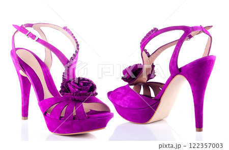 Beautiful purple shoes on a white background Beautiful purple shoes on a white background 122357003