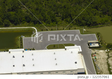 Aerial view of industrial park with goods warehouses and logistics centers in city zone from above Aerial view of industrial park with goods warehouses and logistics centers in city zone from above 122357061