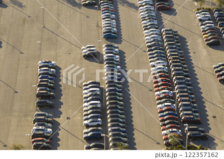 Aerial view of dealership parking lot with many brand new cars for sale. Development of american automotive industry concept 122357162
