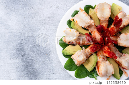 Salad with tiger shrimps , avocado and mango . Top view 122358430