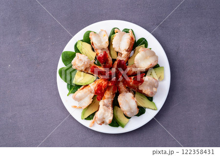 Salad with tiger shrimps , avocado and mango . Top view 122358431