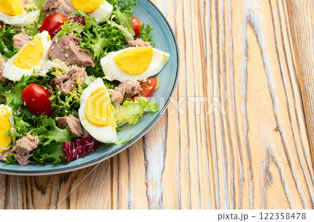 Canned Tuna salad with eggs and tomatoes photography . Top view Canned Tuna salad with eggs and tomatoes photography . Top view 122358478