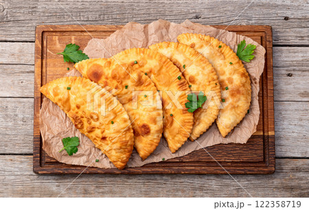 Snack chebureks. Pasties with meat photography . Top view 122358719