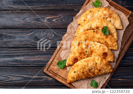 Snack chebureks. Pasties with meat photography . Top view 122358720