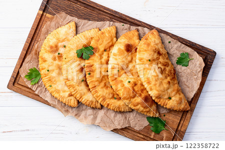 Snack chebureks. Pasties with meat photography . Top view 122358722
