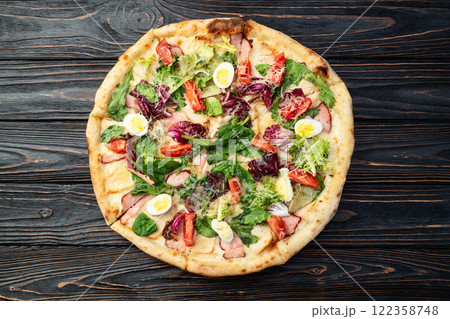 Italian pizza caesar with eggs salad chicken tomatoes and mozzarella photography. top view Italian pizza caesar with eggs salad chicken tomatoes and mozzarella photography. top view 122358748