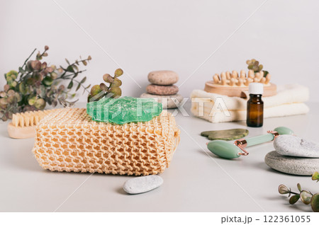 Natural loofah, homemade soap and spa items on table Natural loofah, homemade soap and spa items on table 122361055