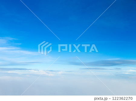 blue sky background with tiny clouds blue sky background with tiny clouds 122362270