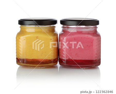 Berry jam in glass jars isolated. Berry jam in glass jars isolated. 122362846