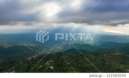 A Majestic and Enchanting Forest Landscape Infused with Warm Sunlight and Soft Clouds 122363039