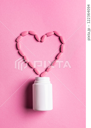 Heart shape made of pink pills Heart shape made of pink pills 122364094
