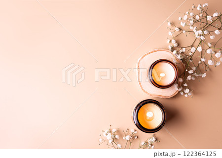 Aroma candles and white gypsophila flowers Aroma candles and white gypsophila flowers 122364125