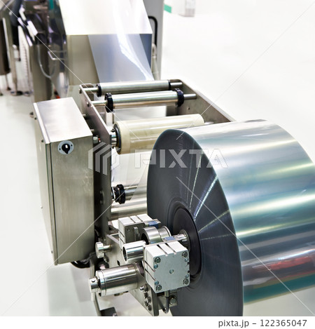 Roll of packaging film on machine food factory 122365047