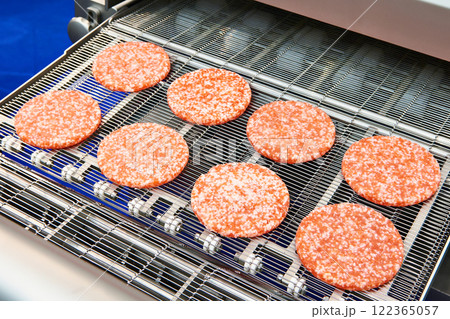 Pieces of minced meat in machine wet breading 122365057