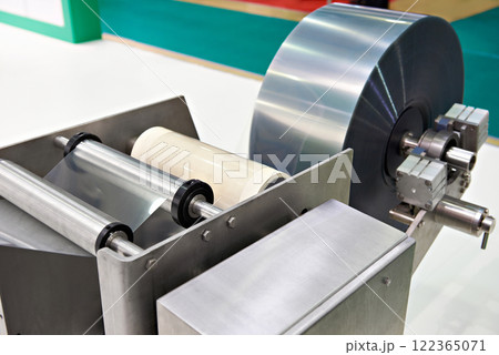 Roll of packaging film on machine food factory 122365071