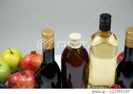 Different types of vinegar, Balsamic, pomegranate and apple vinegars in bottles Different types of vinegar, Balsamic, pomegranate and apple vinegars in bottles 122365197