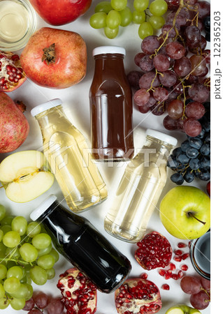 Different types of vinegar balsamic, apple, wine and pomegranate in glass bottles Different types of vinegar balsamic, apple, wine and pomegranate in glass bottles 122365203