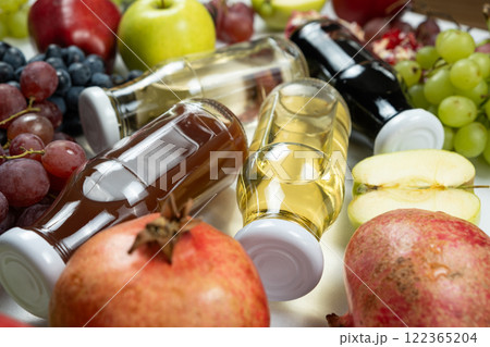 Different types of vinegar balsamic, apple, wine and pomegranate in glass bottles Different types of vinegar balsamic, apple, wine and pomegranate in glass bottles 122365204