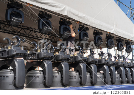 Installation of lighting equipment on a mobile concert stage. 122365881