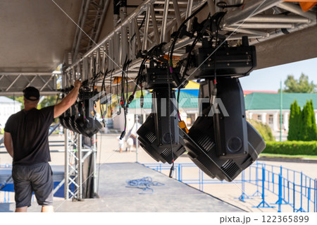 Installation of lighting equipment on a mobile concert stage. Installation of lighting equipment on a mobile concert stage. 122365899
