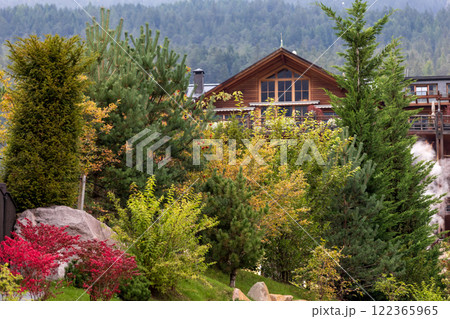 Ortisei, Italy houses and mountains in summer Ortisei, Italy houses and mountains in summer 122365965