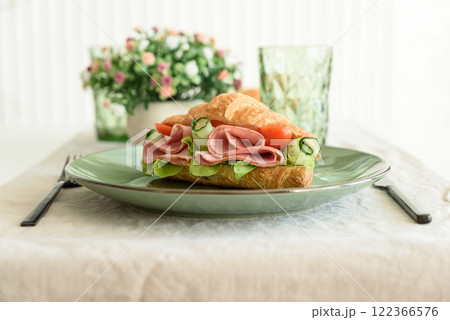 Ham and Cheese Croissant Sandwich. Healthy breakfast. Front view Ham and Cheese Croissant Sandwich. Healthy breakfast. Front view 122366576
