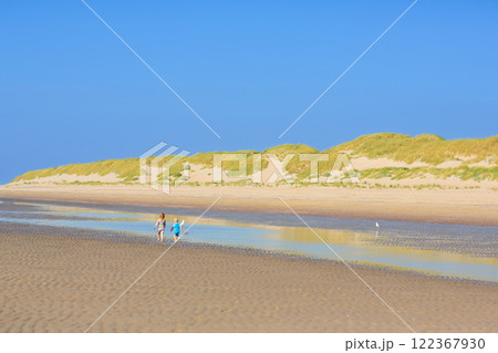 Kids playing on beach. Children play at sea. Kids playing on beach. Children play at sea. 122367930