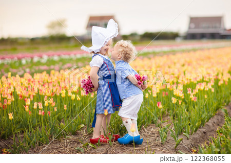 Dutch children in tulip field 122368055