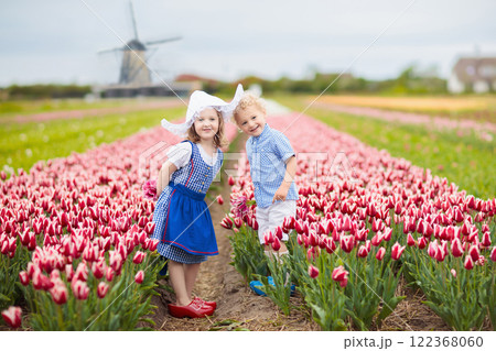 Dutch children in tulip field Dutch children in tulip field 122368060