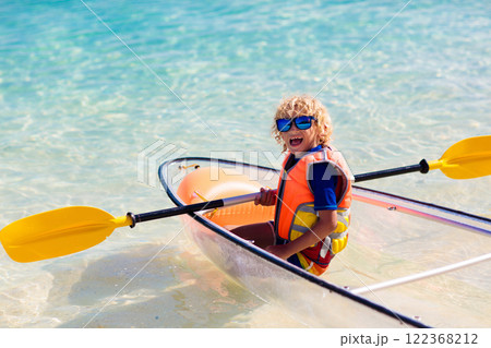 Kids kayaking in ocean. Family in kayak in tropical sea 122368212